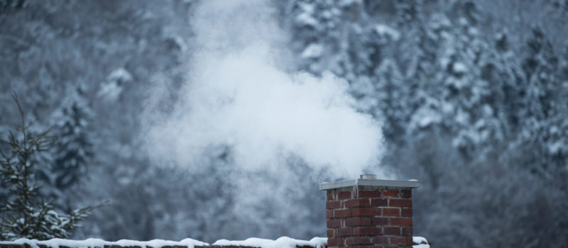Smoking chimney in winter